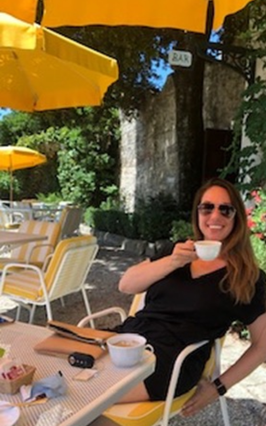 Ali enjoying coffee at an outdoor café