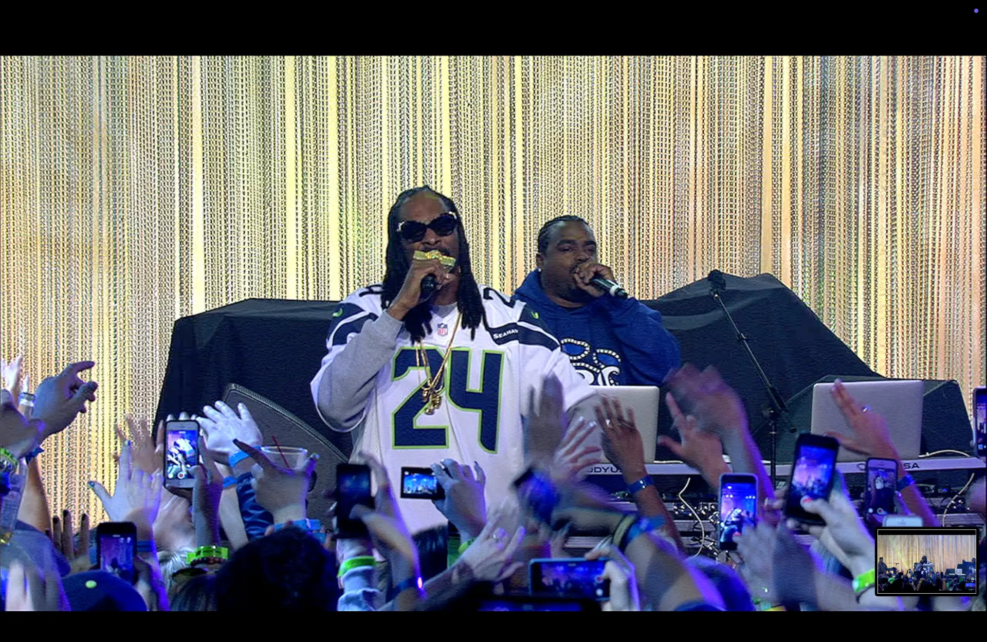 Snoop Dogg performing in a Seahawks jersey