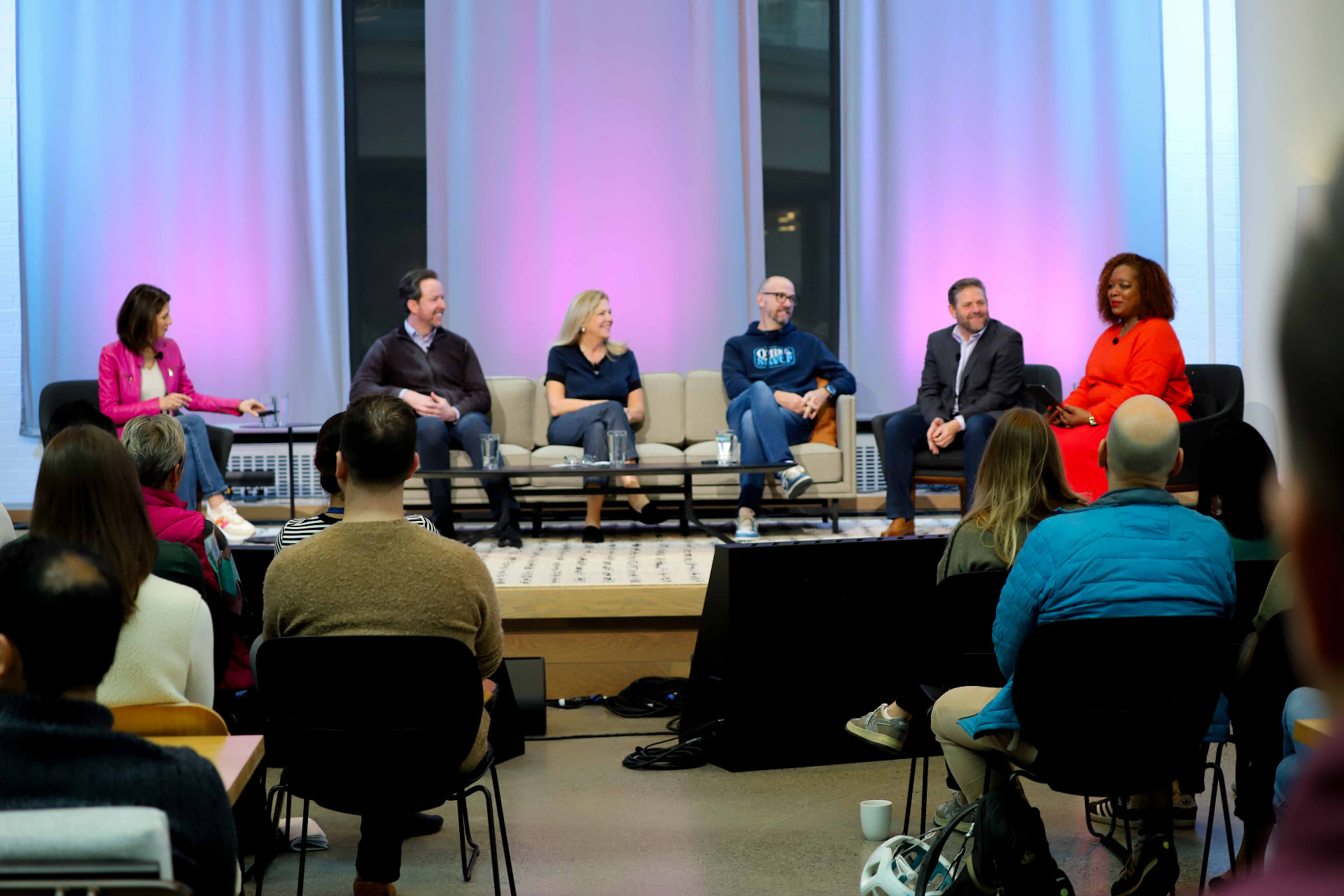 Expedia Group leaders on a produced town hall stage