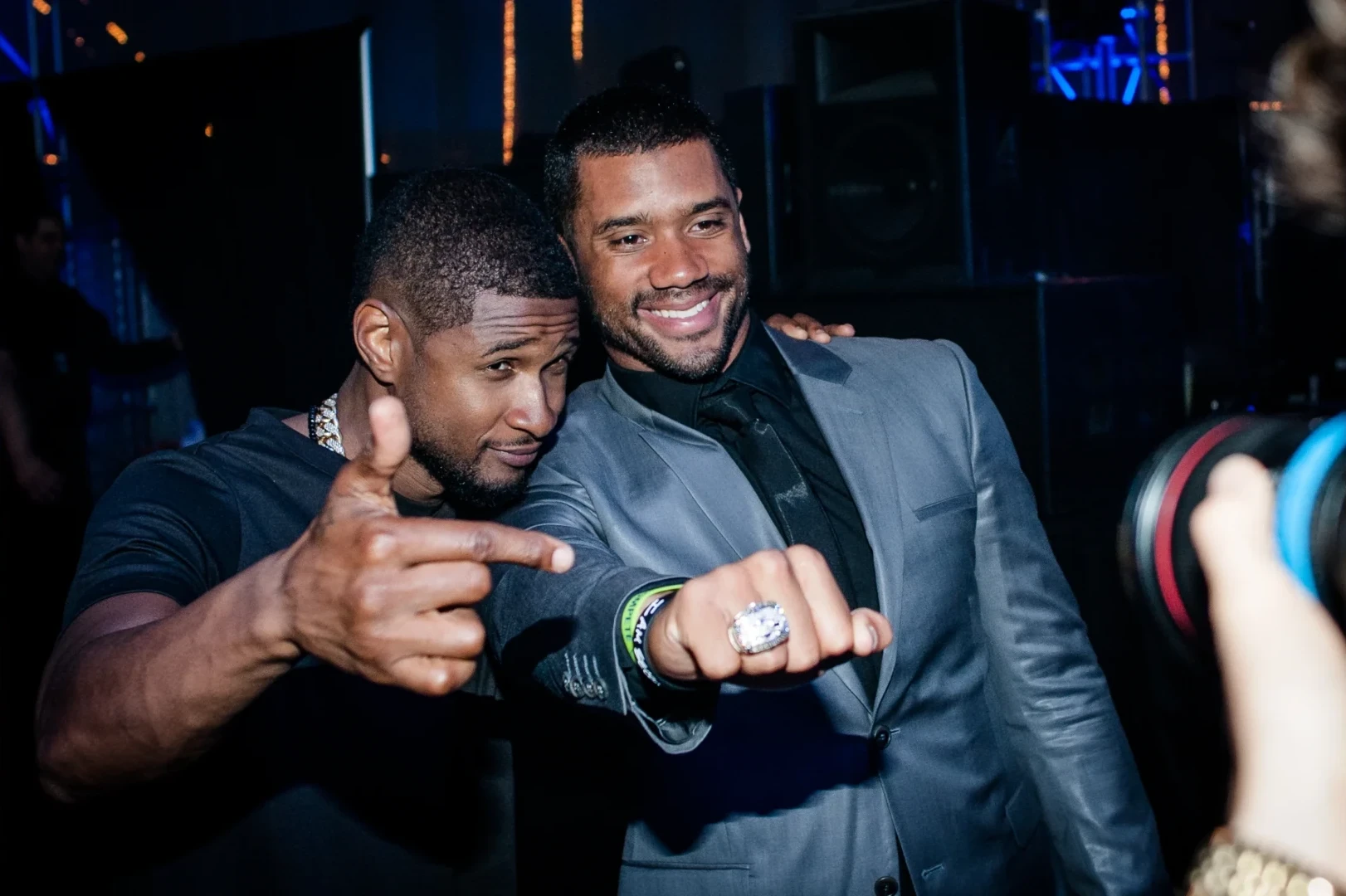 Usher and Russell Wilson showing a championship ring