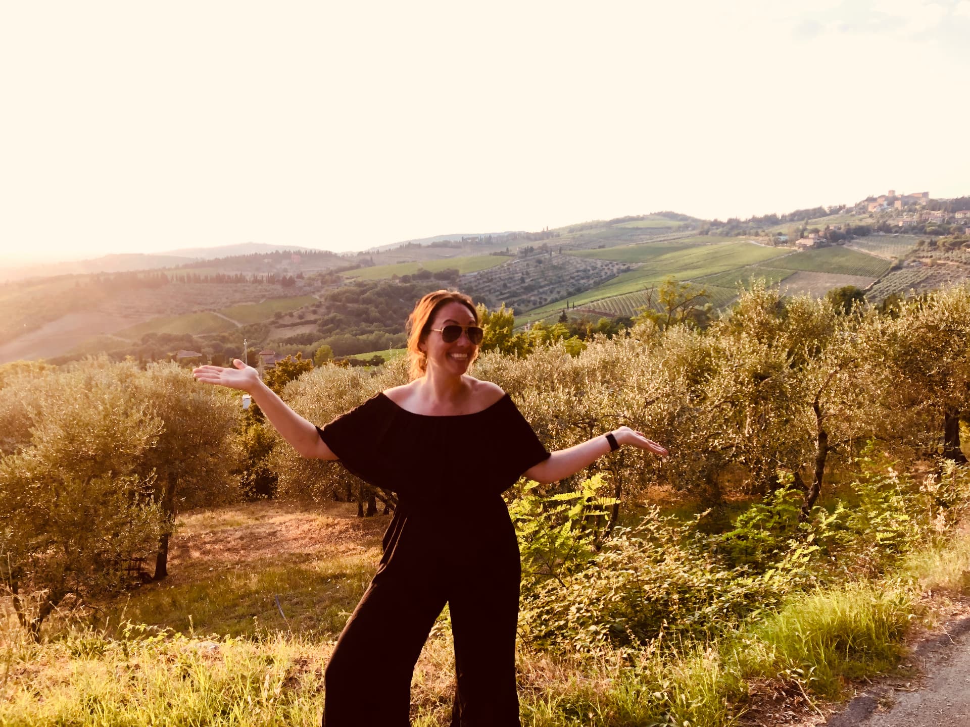 Ali enjoying a hillside landscape while traveling